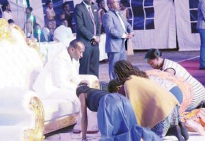 Church members kiss pastors feet during church service
